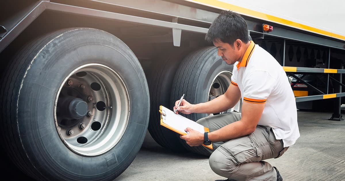 driver performs brake safety inspection