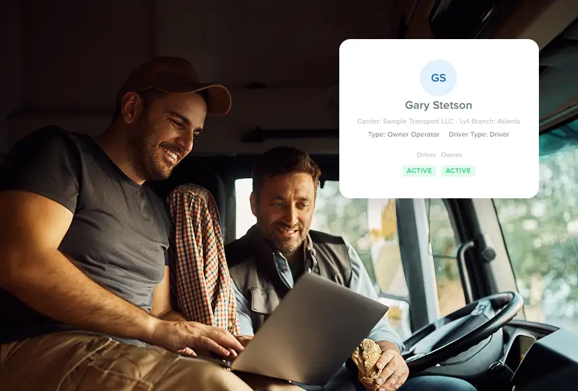 Truck driver happy looking at computer