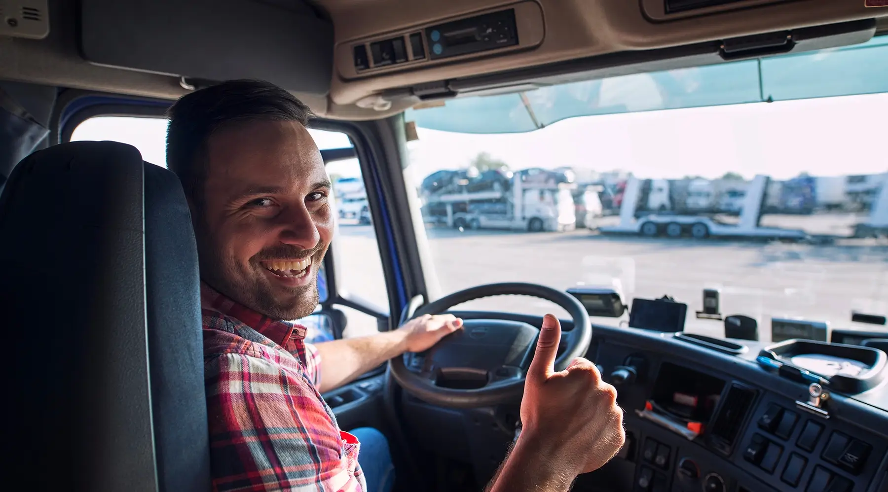 Happy truck driver truck driver smiling with thumbs up
