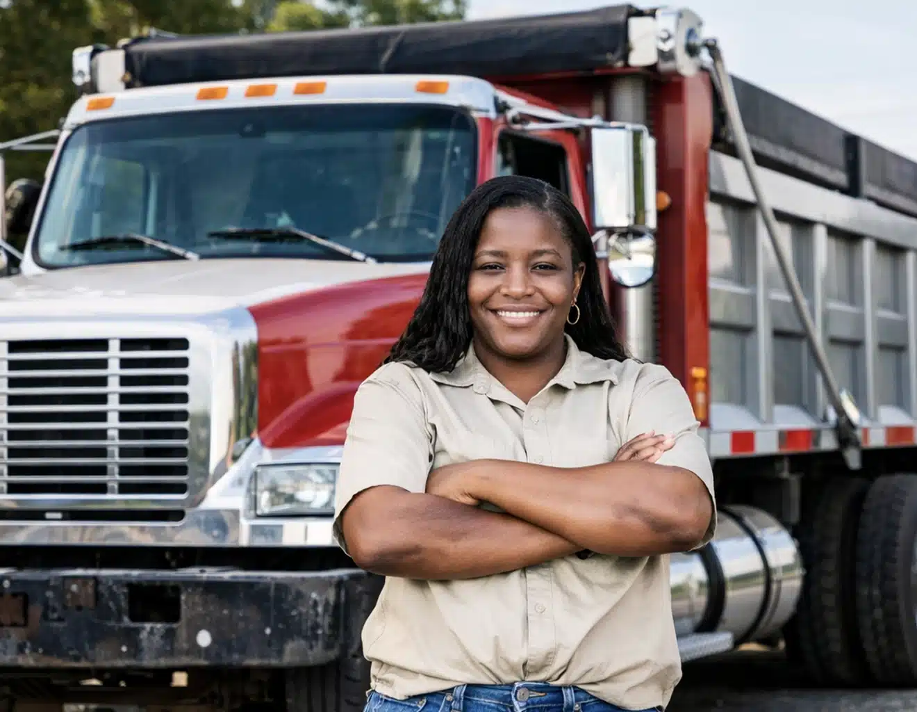Woman with truck truck driver smiling with thumbs up